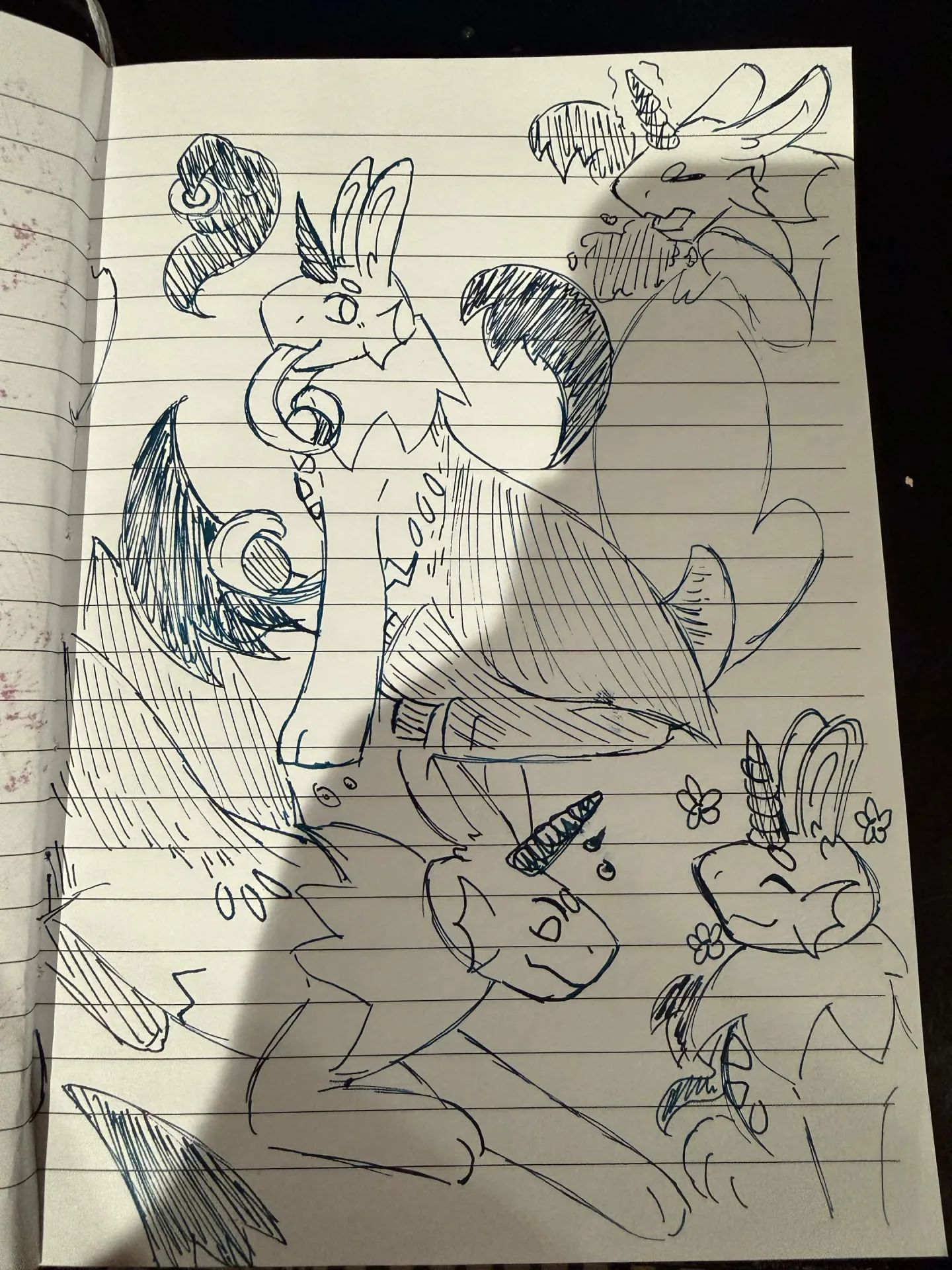 Various doodles in deep blue ink of Sonar, a blocky quadruped creature with bunny ears and large floppy wings.