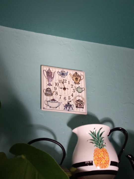 A teapot themed wall clock