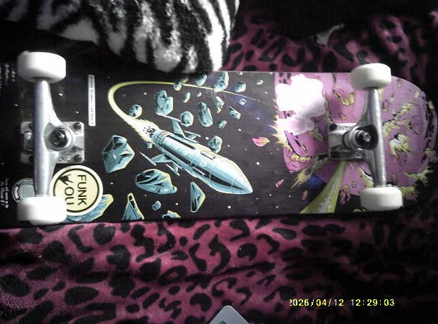 (my skateboard when it was brand new, its more beat up now <3)