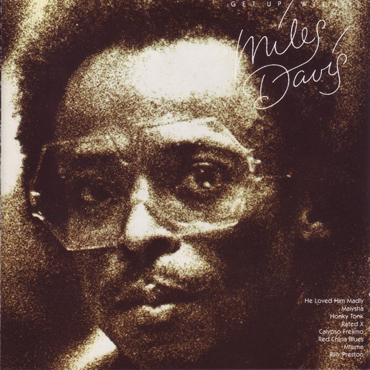 The Get Up With it cover, a sepia toned photo of Miles staring at the camera.