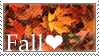 stamp: a close up of orange, red, and yellow leaves. text reads, fall