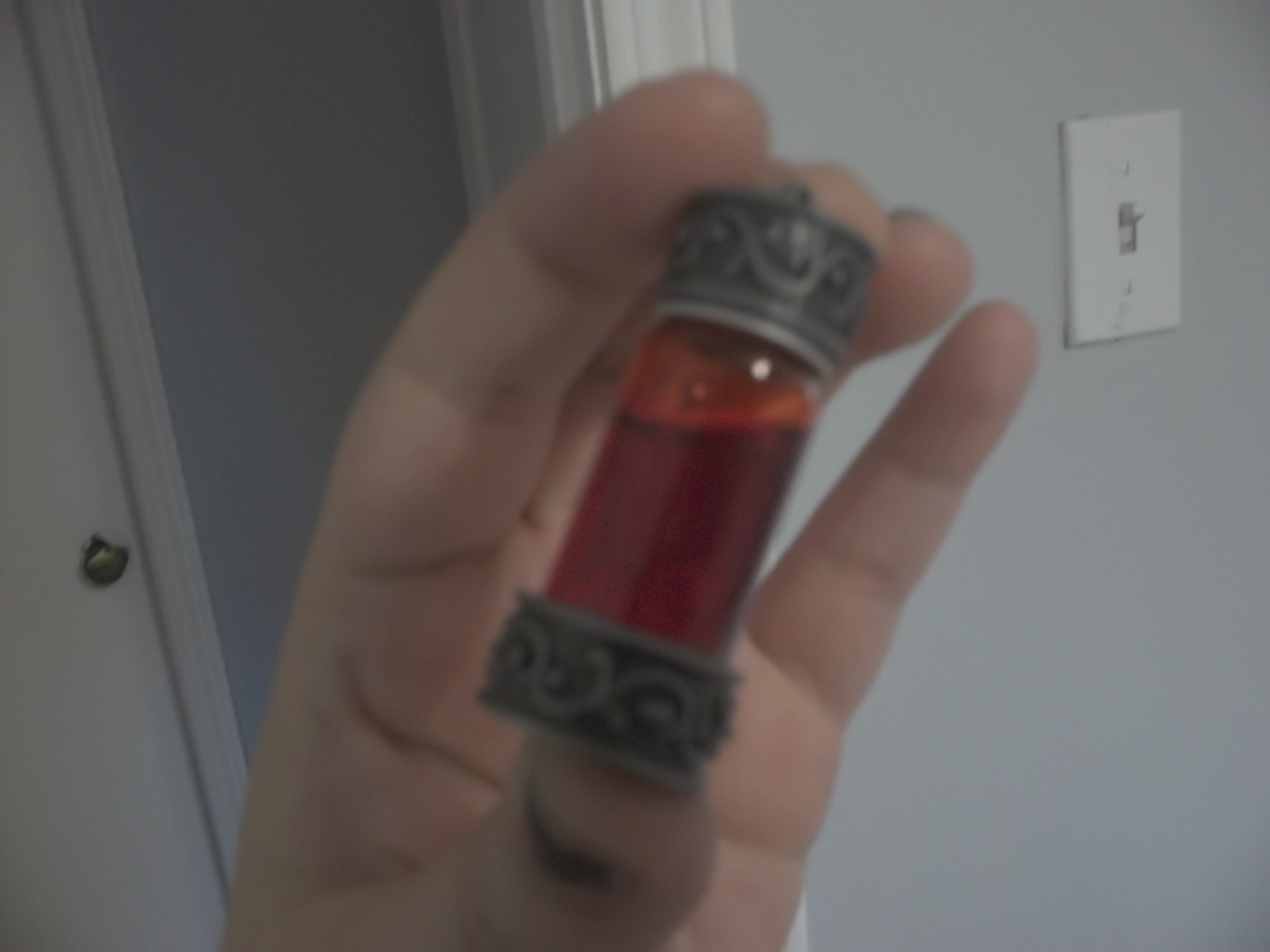 <vile of fake blood>