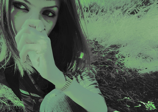 alien sitting in grass