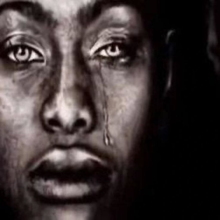 This may contain: a black and white photo of a woman's face with tears on her eyes