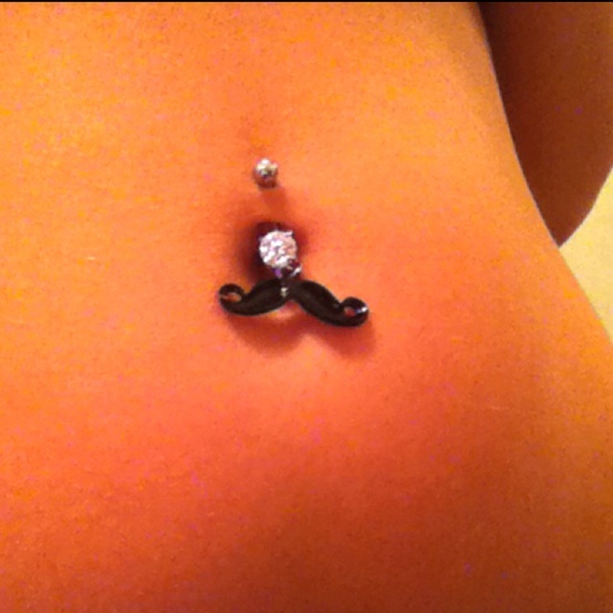 This may contain: a close up of a person's stomach with a fake moustache on it