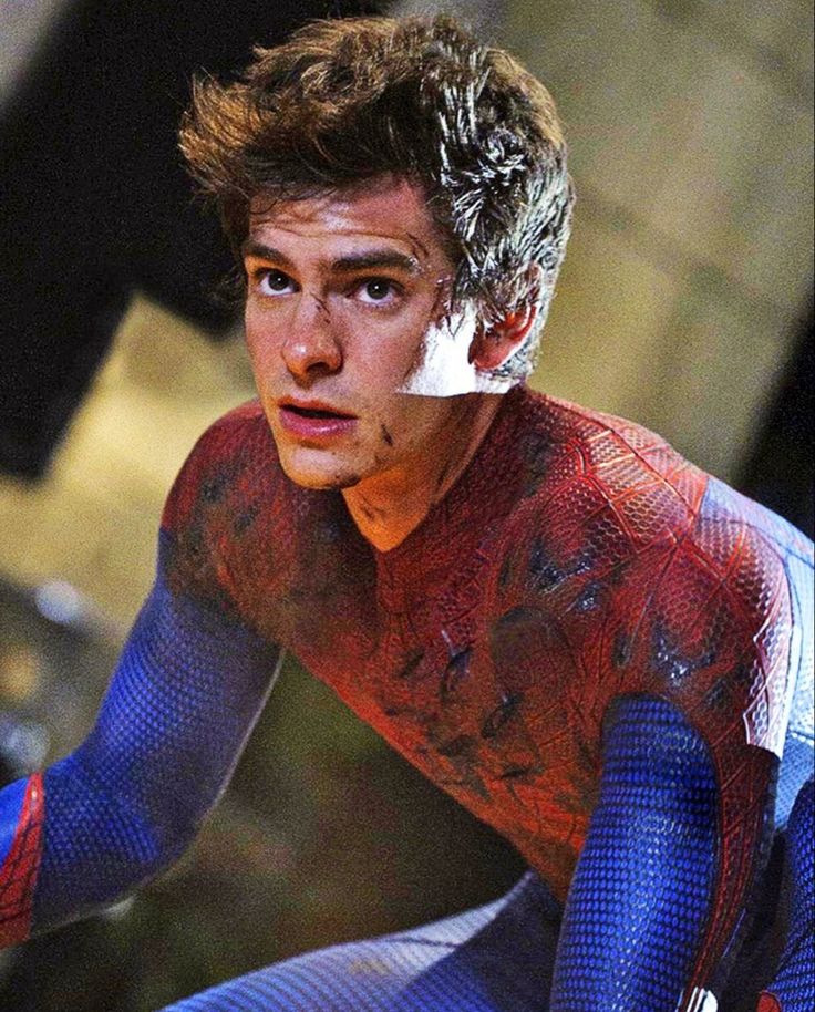 This may contain: the amazing spider - man is in action on his bike