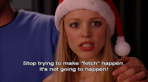 This may contain: a woman wearing a santa hat with the caption it's not going to happen