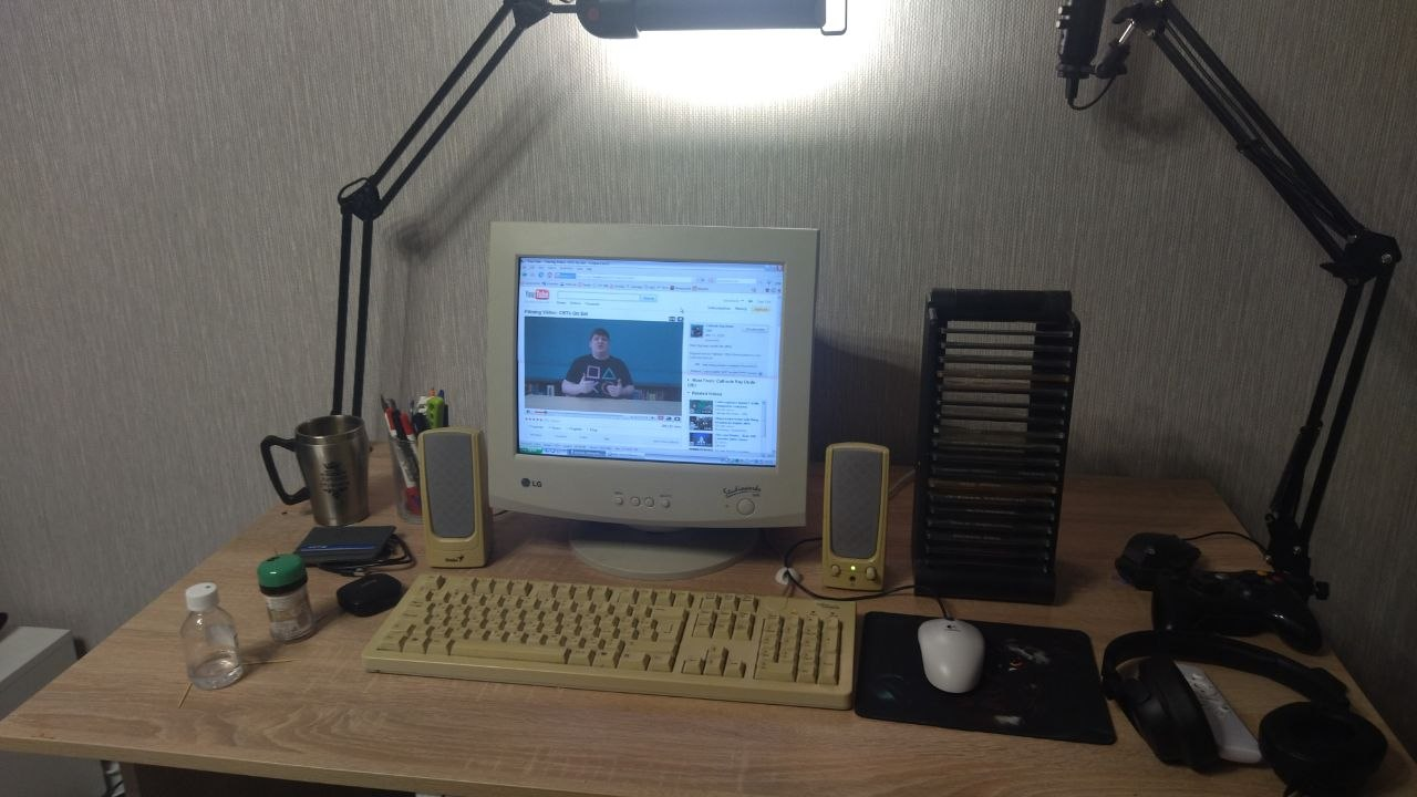 a cosy Windows XP gaming rig with Cathode Ray Dude video playing on a CRT display