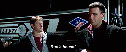 mat damon holding a gun in the air saying "runs house" like the runs house run dmc song
