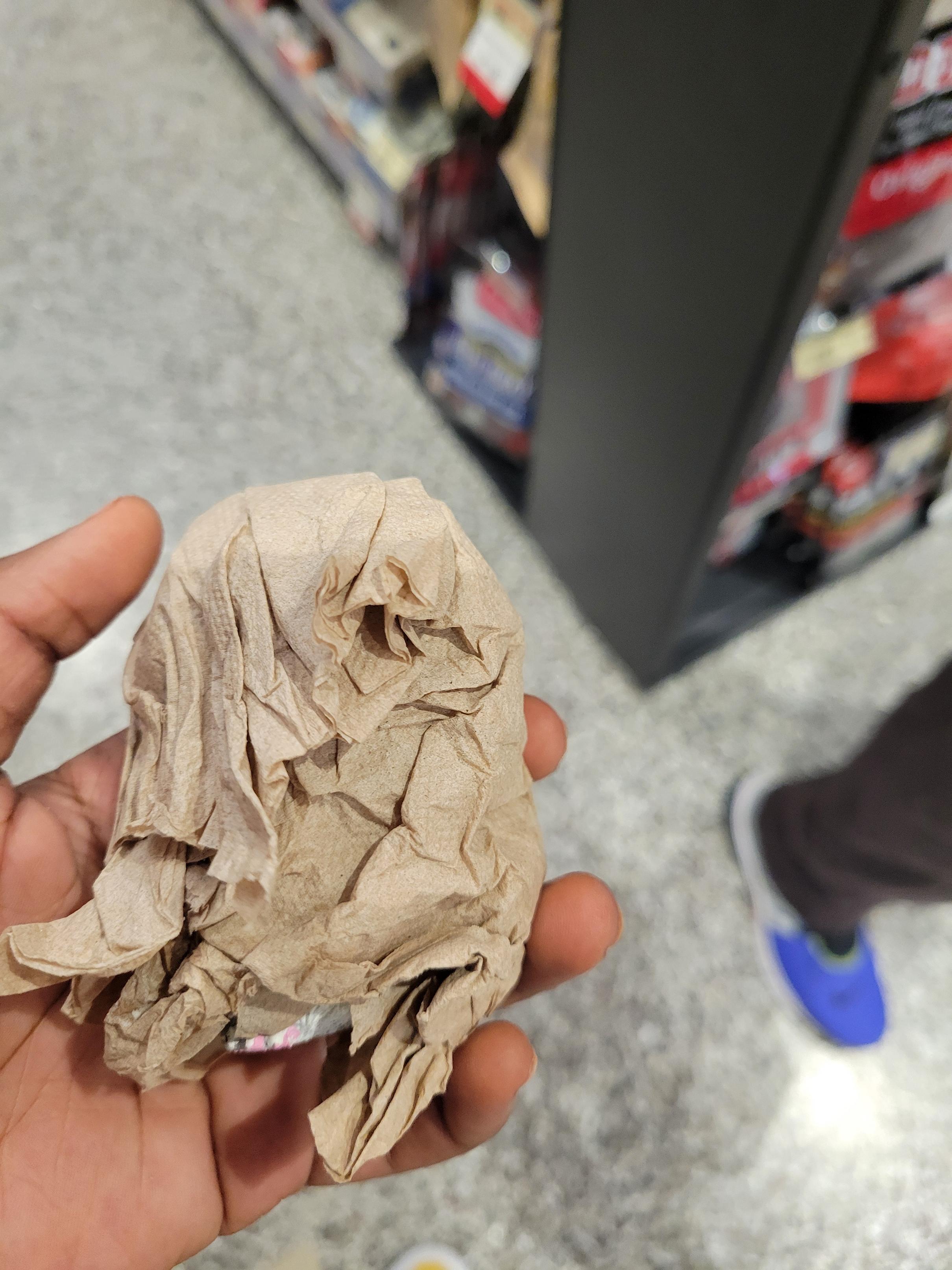 Toy hamster is wrapped around in napkins
