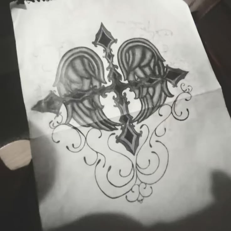 cross drawing with wings