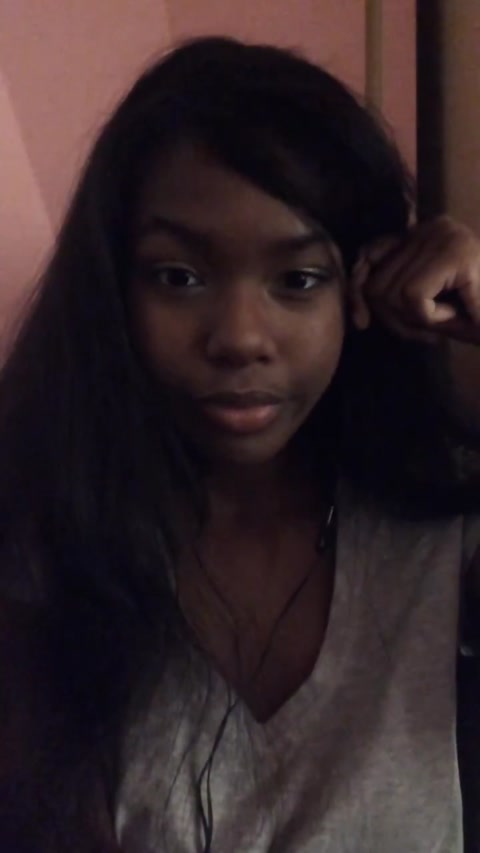 darkskin girl makes faces and gives herself face lift