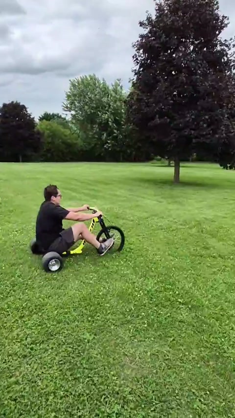 Riding a broken trike with my friend