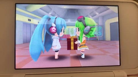 Gumi gives Miku a present