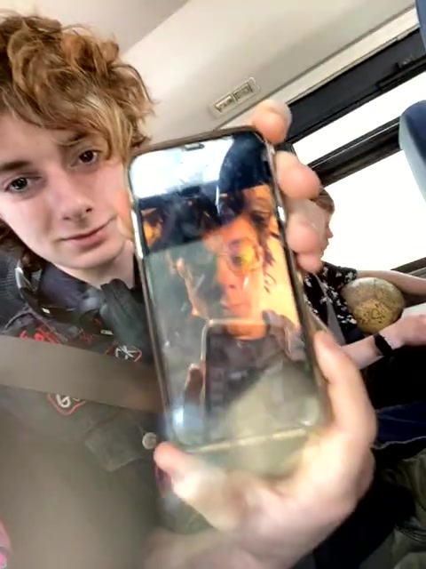 Emo girl on the bus with her metal head friend